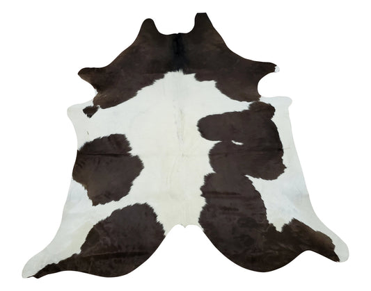 Handpicked small cowhide rug with lots of white, reddish-brown and some black in the background, this piece will give luxurious touch.
