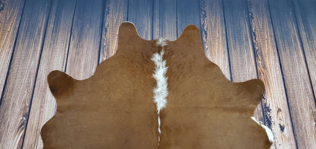 If you're looking for a natural, real cowhide rug in Canada, decor hut is the place to go. We have a wide selection of small cowhide rugs in a variety of colors, including dark brown.
