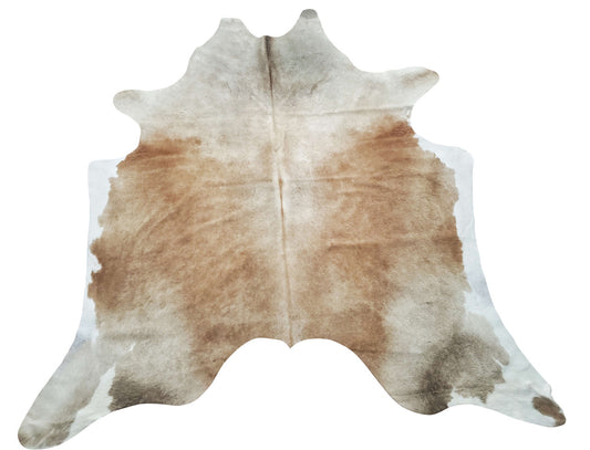 A stunning beige brown cowhide rug with a perfect touch of rustic to liven up your entryway, front porch or living room.