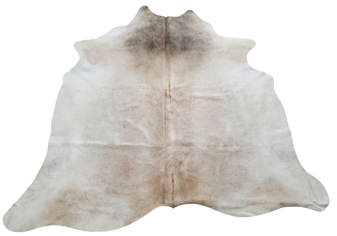 In a modern room this medium grey cowhide rug will add the texture it is missing and tan in the background will give a touch of excitement.