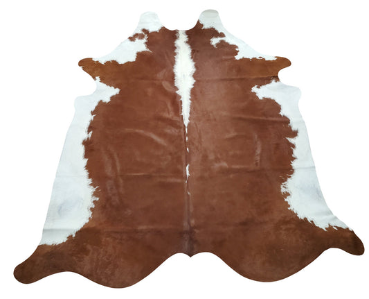 A new brown hereford cowhide rug with a perfect balance of natural and modern shade.  
