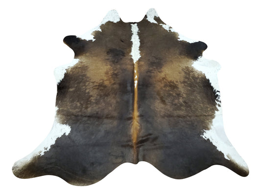 A small cowhide rug in rich tricolor texture can make a big impact in your home décor. It can add a touch of luxury and warmth to any room. 
