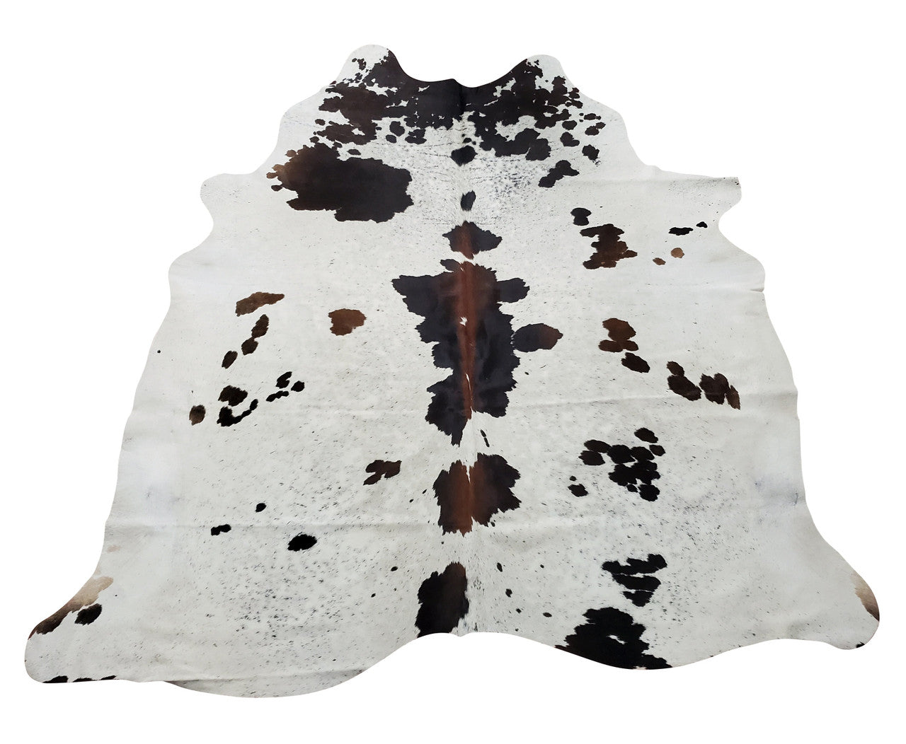 A real western style speckled cowhide rug is must for this season, mostly brown in the middle and white on the edges.