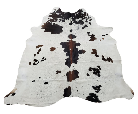 A real western style speckled cowhide rug is must for this season, mostly brown in the middle and white on the edges. 