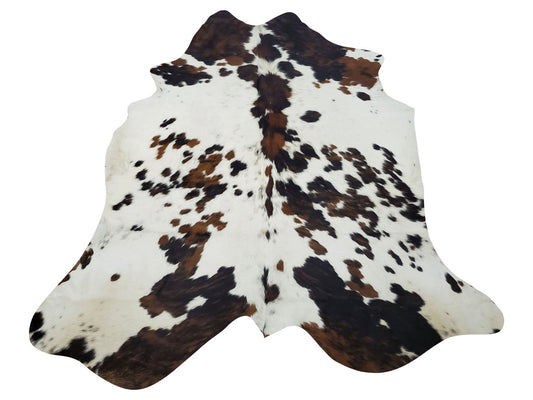 If you are wondering how to place a dark cowhide rug in your basement or living room, this would look great under a coffee table or for entryway decor, we wont be shy to try it in fireplace room. 