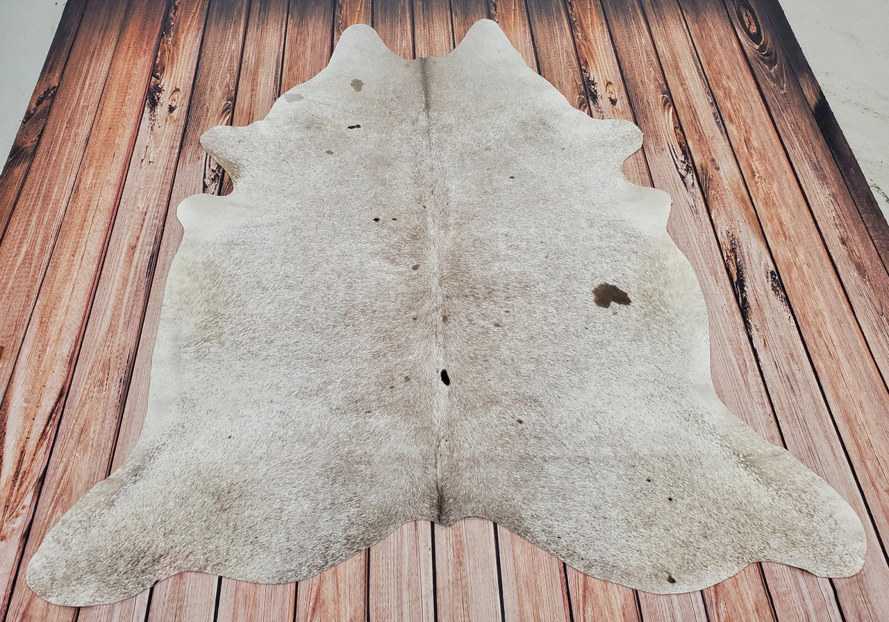 Large cowhide rug in Dawson Creek stunning speckled light grey with black tan mark hundred percent natural and unique.