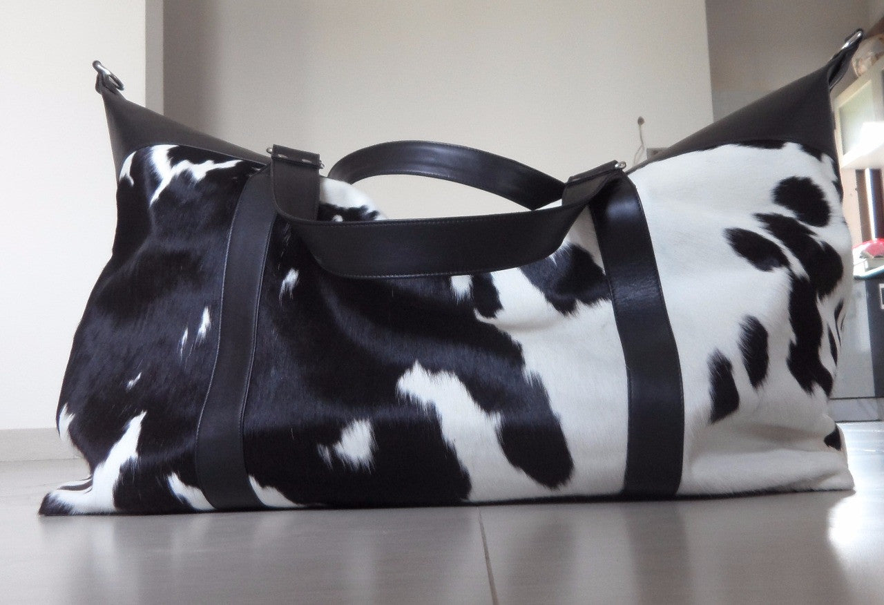 cowhide weekender bag black and white