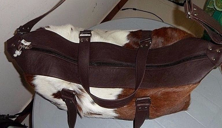 Brown And White Cowhide Duffel Bag