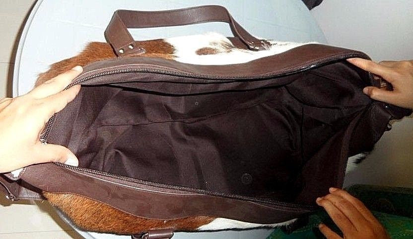 Cowhide Duffel Bag.
