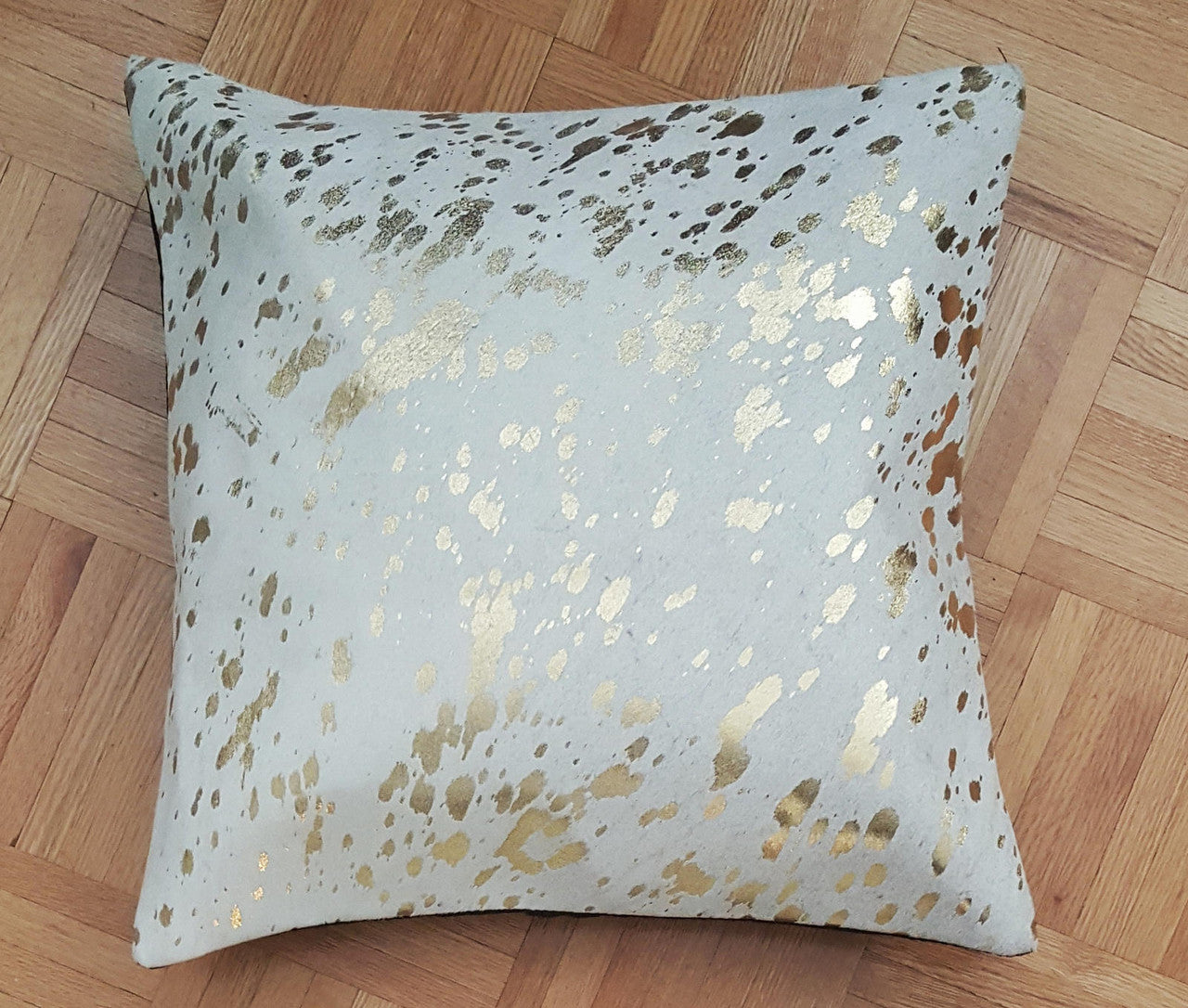 These metallic cowhide pillows are wonderful! add them to your husband’s office chairs and we love them.