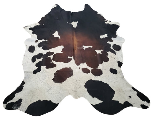 A stunning exotic deep shine tricolor cowhide rug can be added to your country, rustic or log cabin, it will be a fun conversational piece. 