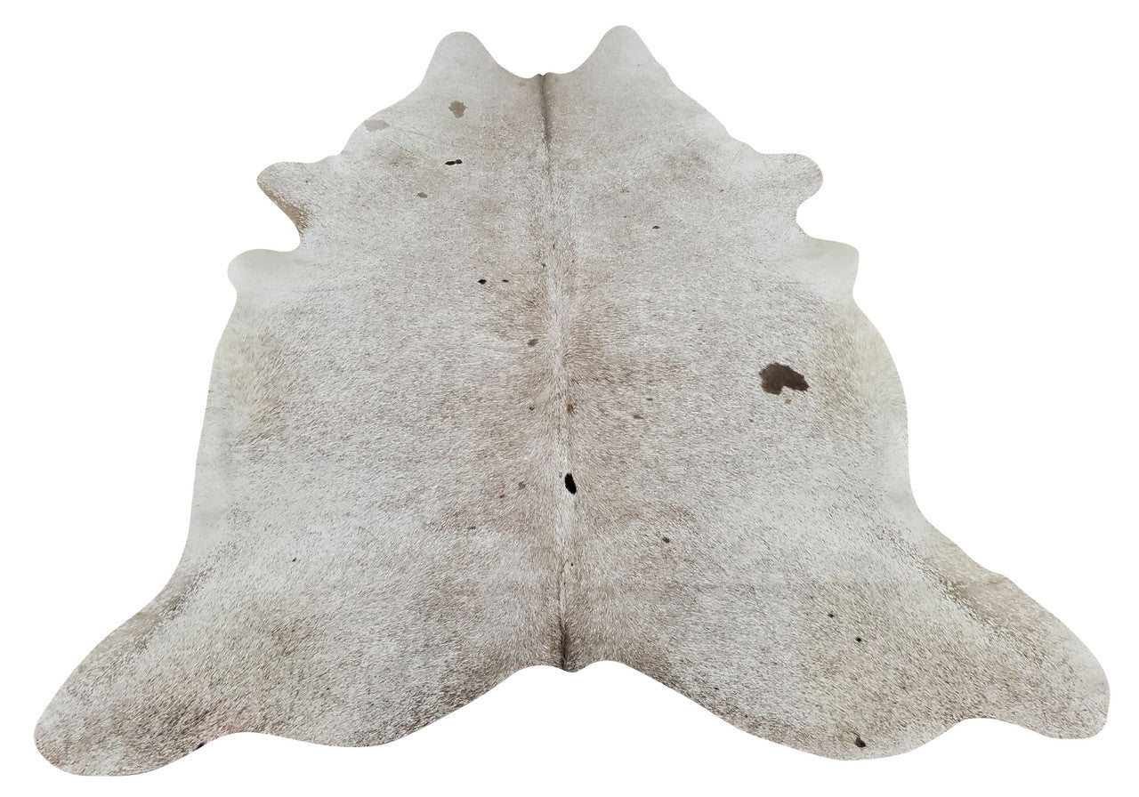 A speckled cowhide rug with some solid spot with grey and white, this is a stunning hide rug in salt and pepper.