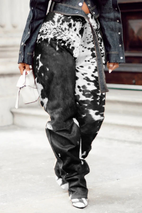 Women’s black white cowhide pants made from real cow skin. Cow print trousers with wide leg fit and bold natural hair on hide design.