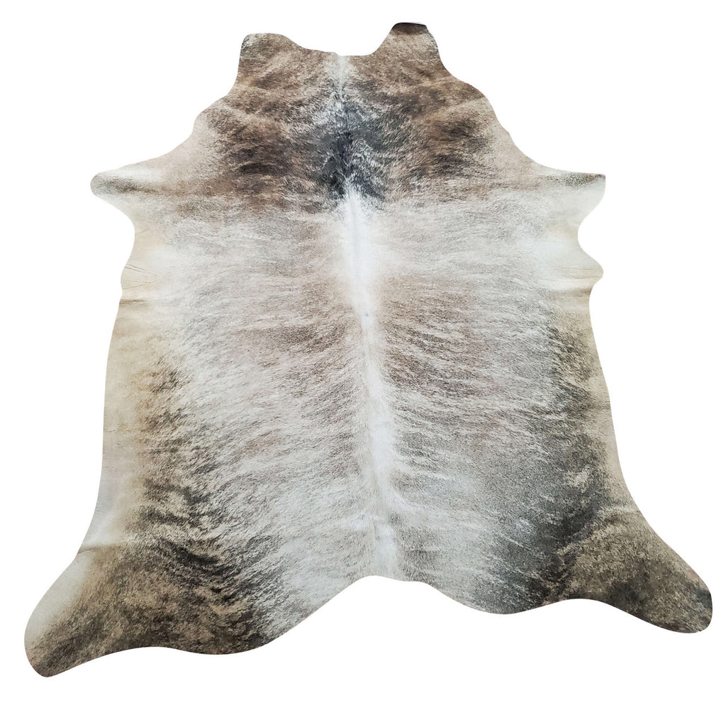 A cowhide rug Edmonton handpicked for its exotic shine and beautiful pattern. Grey stripes on tan background looks and feels stunning.