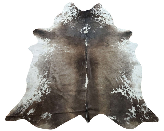 This beautiful large dark cowhide rug in exotic black brown white Is just gorgeous, perfect for your man cave, hundred percent natural and real
