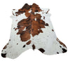 This stunning dark brown white cowhide rug is sure to bring a unique and modern touch to any room. Its spotted pattern adds texture and visual interest.
