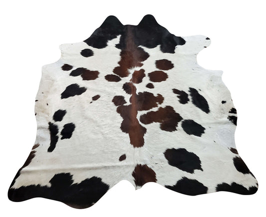 These stunning hand selected Cowhide rug is a mix of authentic brown with natural white and some black great for office.
