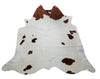 The cowhide rug fits living room perfectly, brown white natural marking lightens the space and warms it up. It will be an awesome cow hide