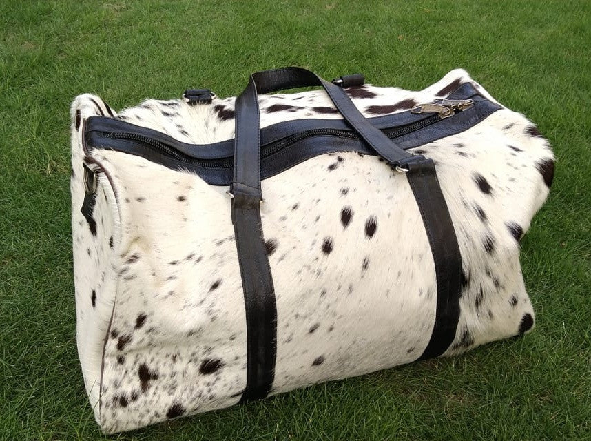 You will absolutely love this cow skin overnight bag beautiful and perfect Christmas gift daughter will love it Perfectly described, added white is perfect