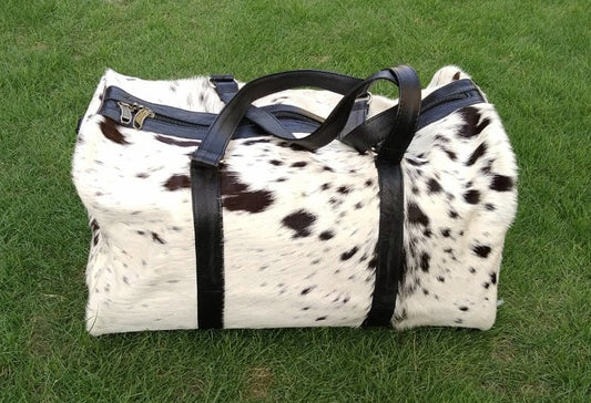 Fast shipping on all our beautiful cow skin bags in black white real cow skin,  definitely enjoy using this cow skin bag daily.