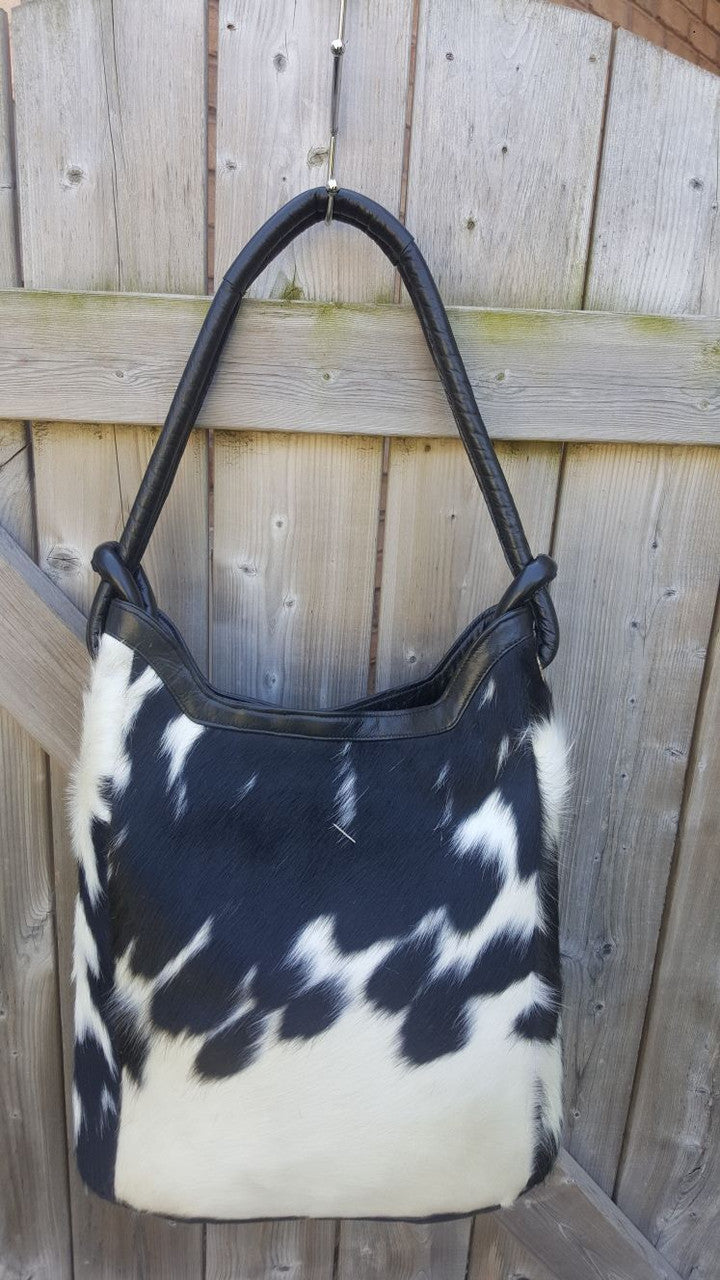 Trending black and white cowhide bag will make a great gift for a friend who loves unique vintage items, fast shipment and natural products.