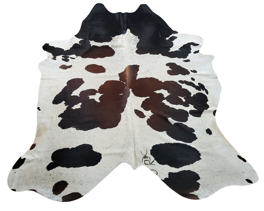 This cowhide rug is just what I ordered! It looks great in my room, next to the coffee table. Great price, too! These rugs are made out of genuine, natural cowhides.
