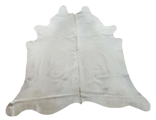 Cream cowhide rug with some ivory and touch of neutral is stunning, it creates a home that is beautiful and inviting 
