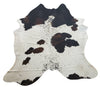 Beautiful extra large cowhide rug in tricolor, soft and well treated perfectly white, brown, and black looks great dark hardwood floor, It is a standout.