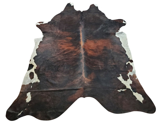 This cowhide rug is a stunning, It will elevate any room. very soft and well-made. The brown and off-white coloring are muted but beautiful, and it suits the room well.