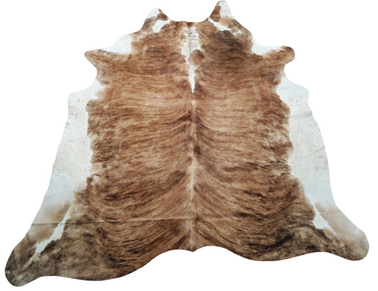 A beautiful Brazilian brindle white belly cowhide rug that will add boho to your modern farmhouse stunning natural and unique marking and pattern