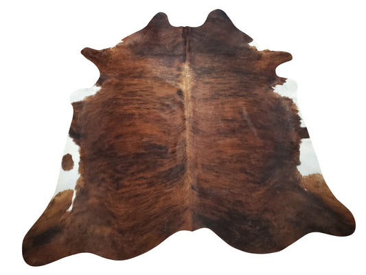 An exotic cowhide rug mix of simple brown and brindle chic that will enhance look of any room in your house these are free shipping all over Canada and the USA.