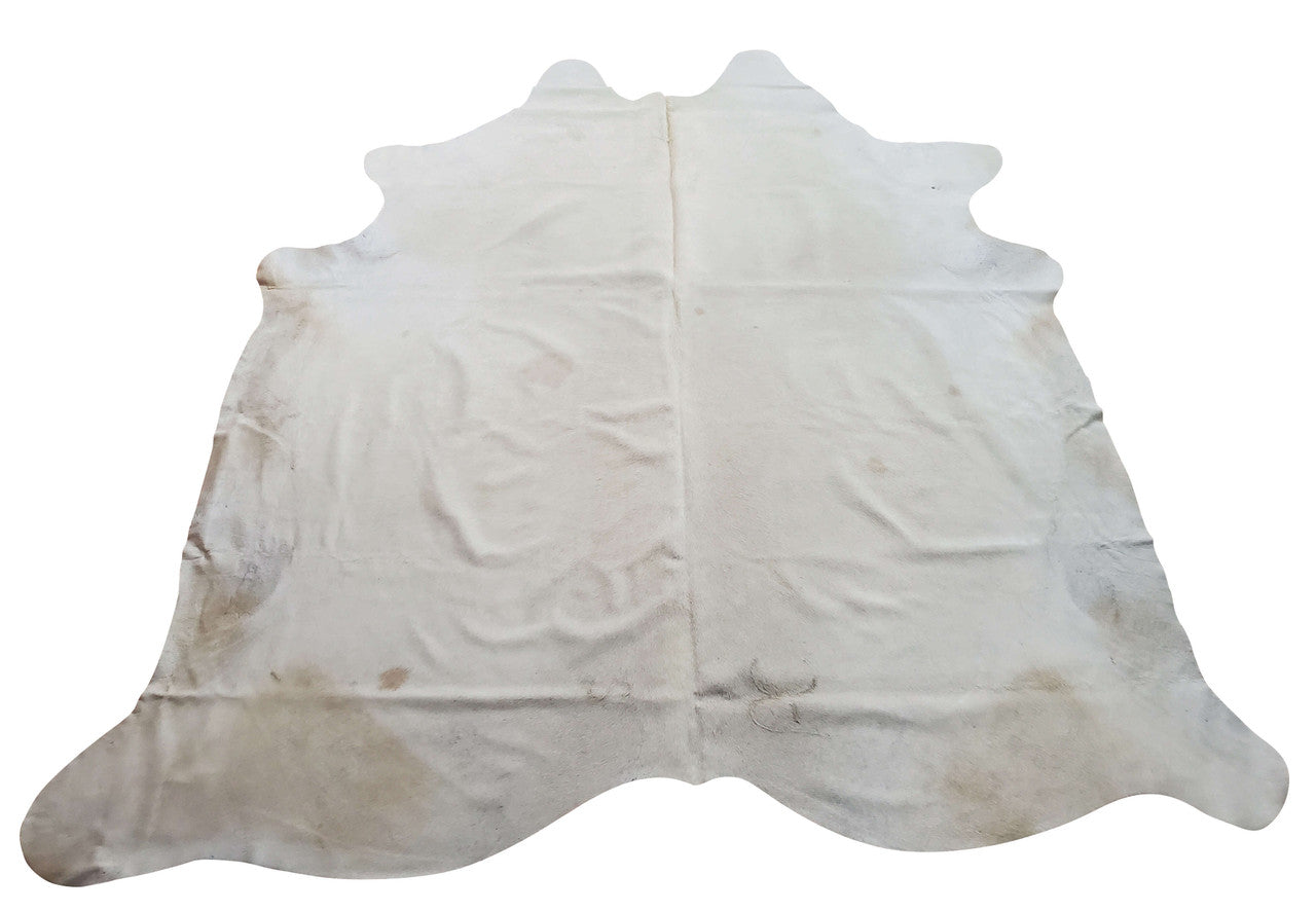 A natural handpicked cowhide rug in speckled perfect for an entryway or the cream white will also match your fireplace decor.