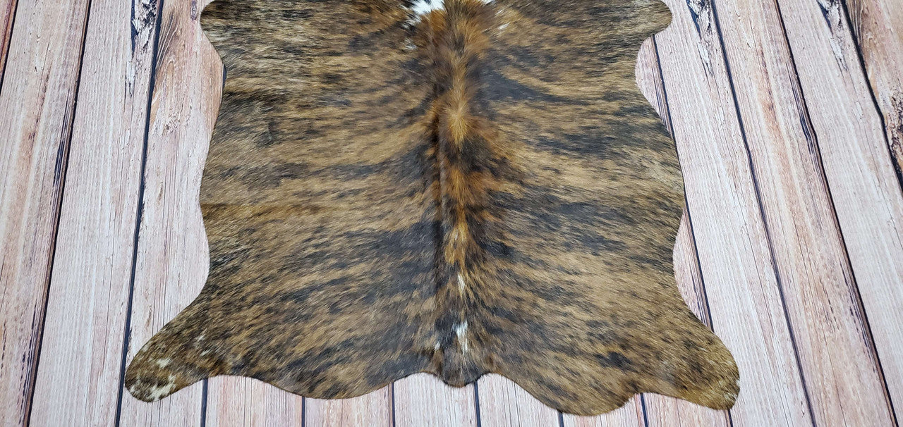 A new brown white cowhide rug in unique extra small size will add charm and beauty to your interior and loved by designers Canada wide.