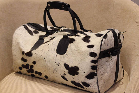 One of its kind these cowhide cross body bags are made on order, perfect for your week or any travels.