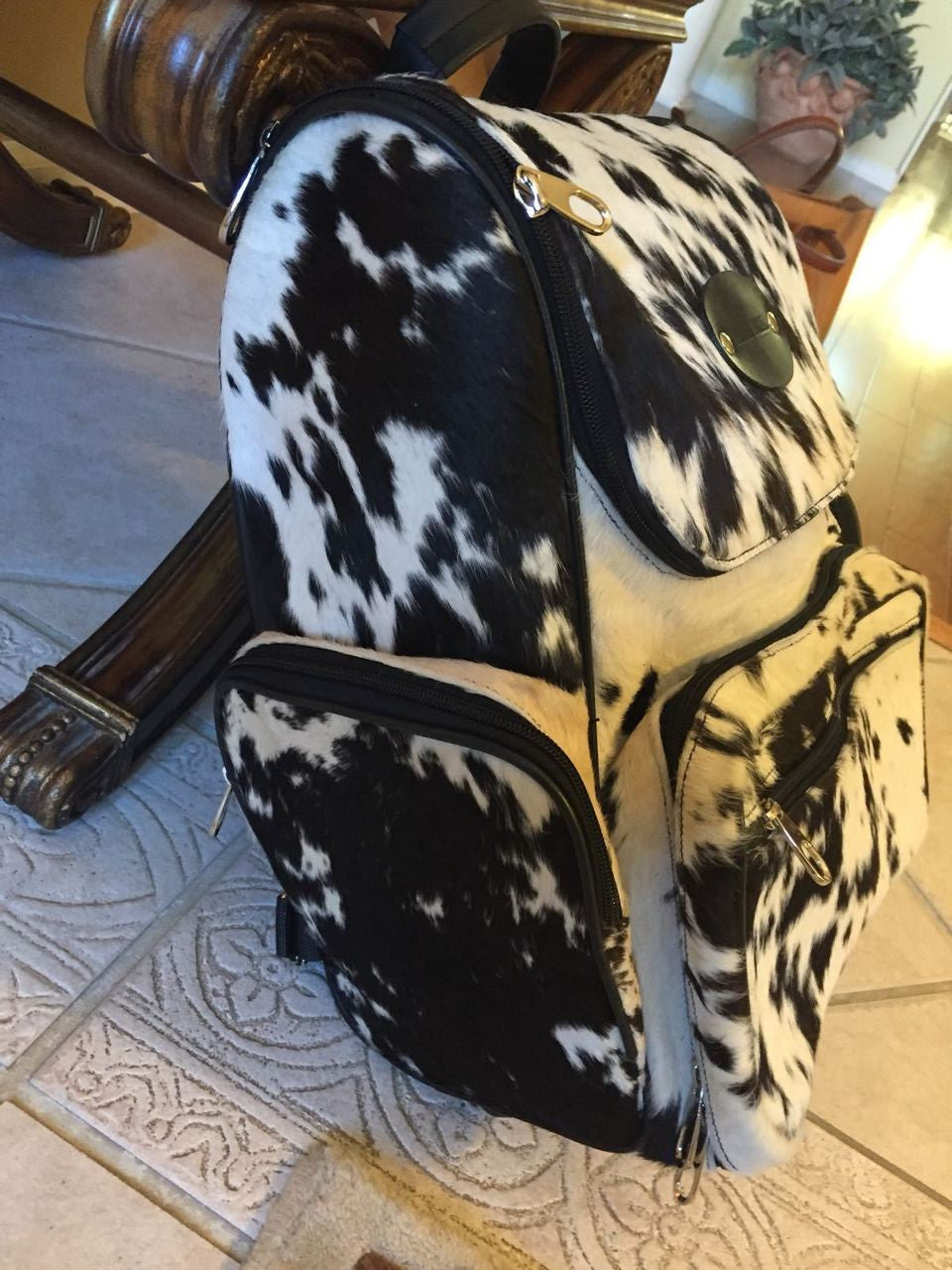 if you looking for real cowhide purses , all our bag packs are
