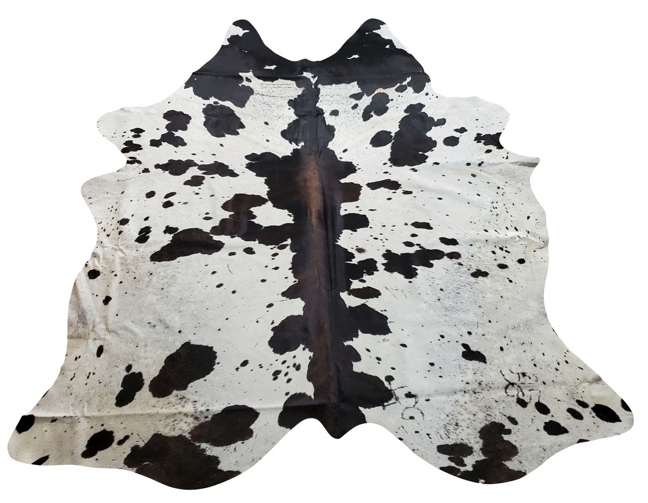 One thing about the dark reddish tricolor cowhide is that the actual cow hair is very flat, thus making for an ideal for a rug.