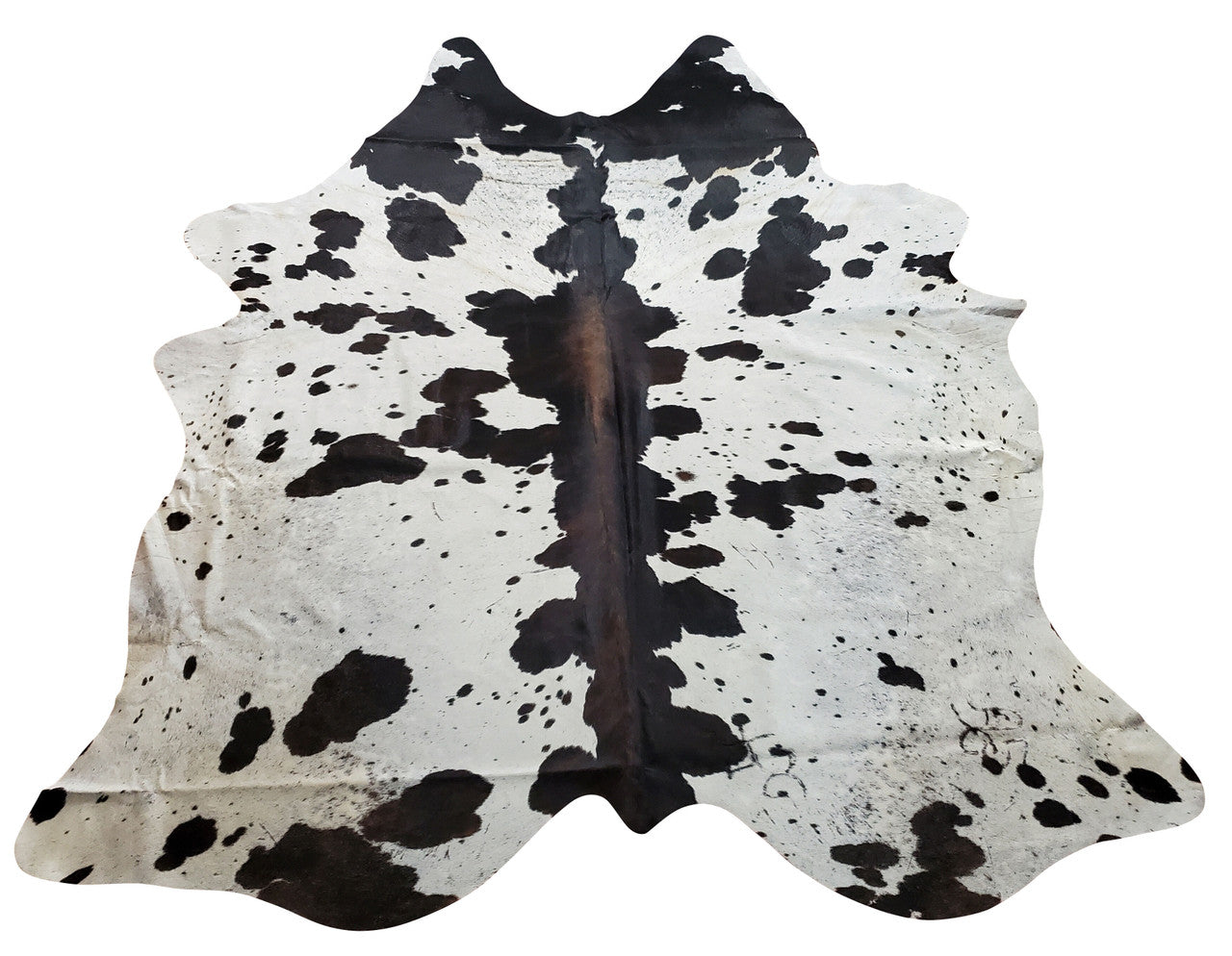 One thing about the dark reddish tricolor cowhide is that the actual cow hair is very flat, thus making for an ideal for a rug. 