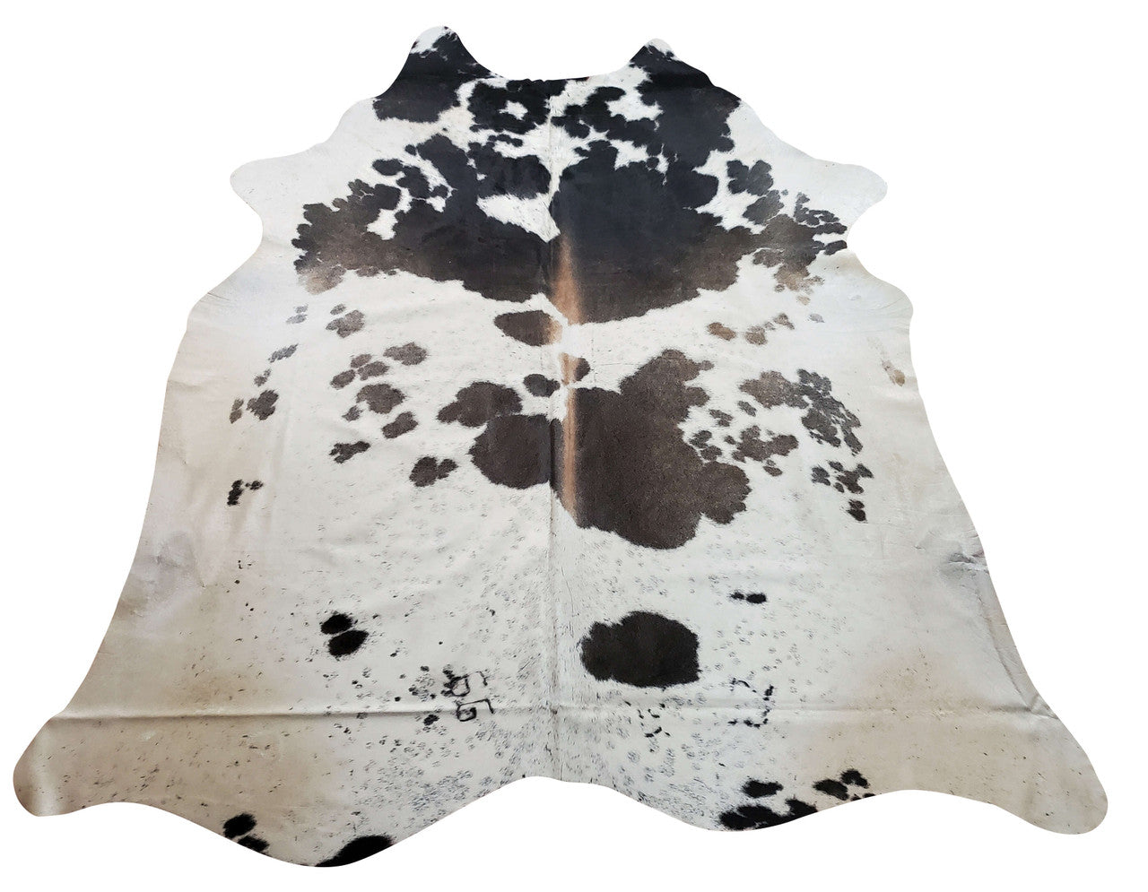 This dark-, silver-, and black-speckled tricolor cowhide rug is expertly made and pleasing to behold.