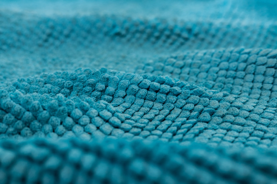 blue and white knit textile