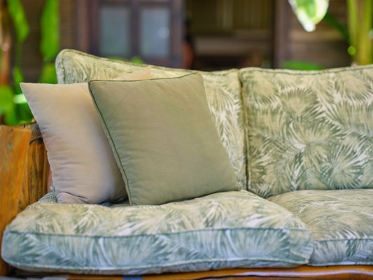 a couch with a bunch of pillows on top of it