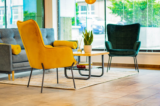 a living room filled with furniture and a large window