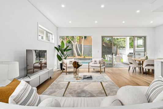 A living room filled with furniture and a flat screen TV