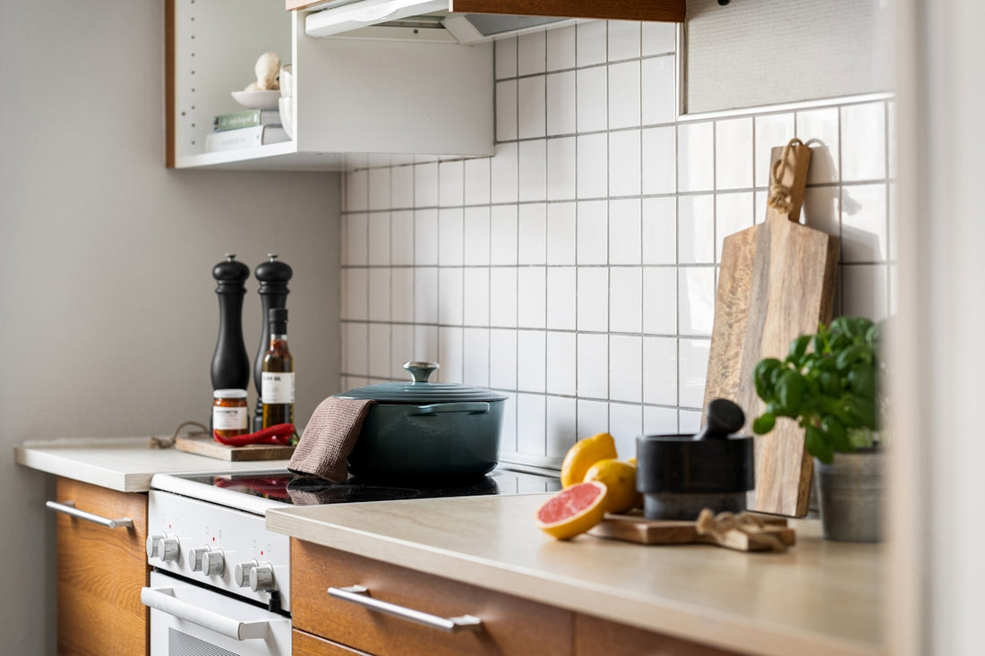 A kitchen with a stove top oven sitting next to a counter
