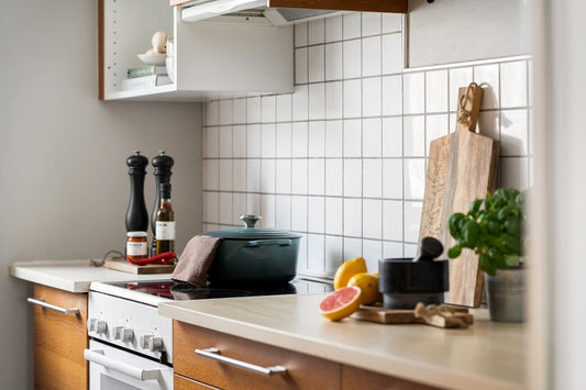 A kitchen with a stove top oven sitting next to a counter