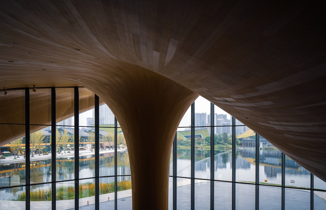 Modern wooden architecture with large windows and water view