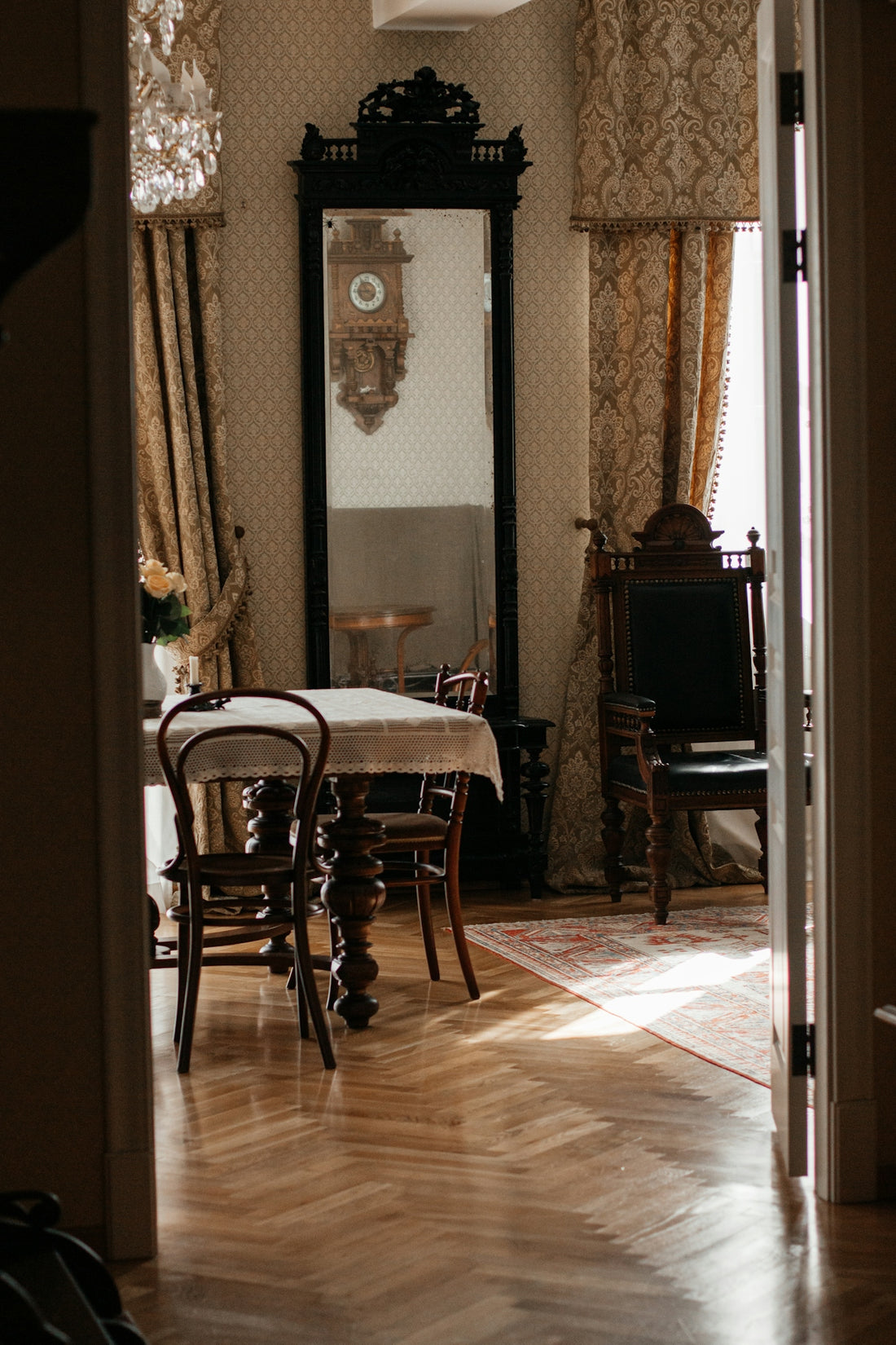 Ornate antique room with a table and mirror