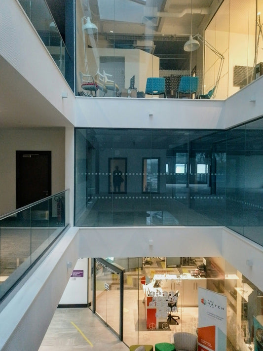 Modern office interior with glass walls and walkways