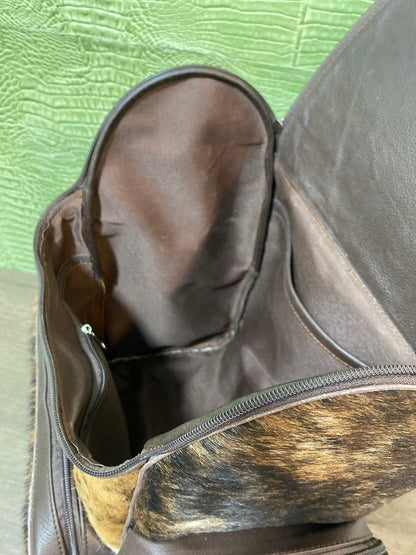 Not only this cowhide backpack is incredibly soft and smooth to the touch, but its unique pattern makes it an eye catching statement piece. The spacious interior makes it perfect for storing your school supplies or travel essentials in style. Its versatility also makes it the ideal choice when you need a comfy companion on evening trips or shopping excursions.