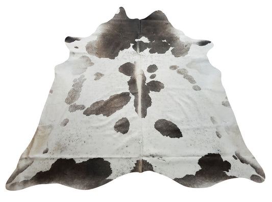 Brazilian cowhide rugs are the best quality and grey and white just brings out the midcentury modern inspirations from any western or southern space.