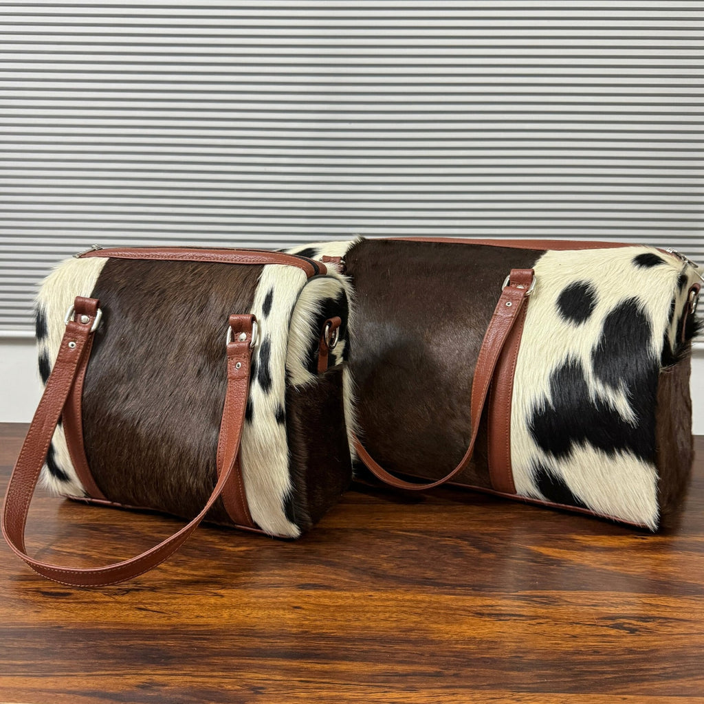 Set Of Cowhide Duffle Bags